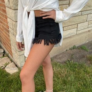 Black fringe mini shorts